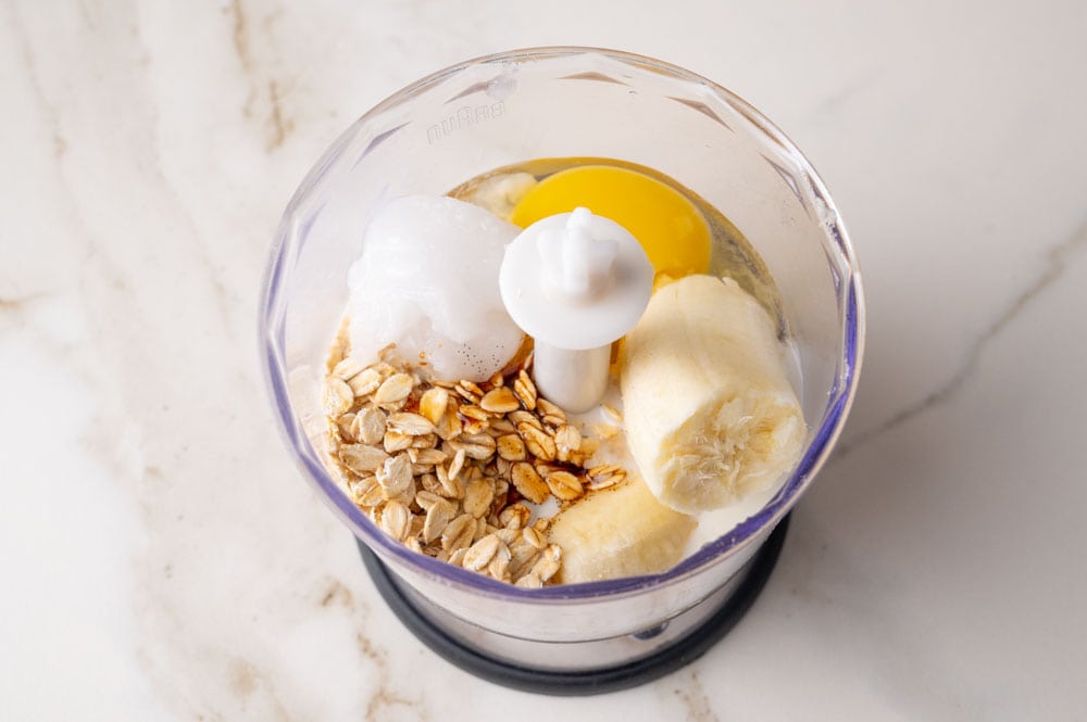 Ingredients for the baked oats in a blender container.