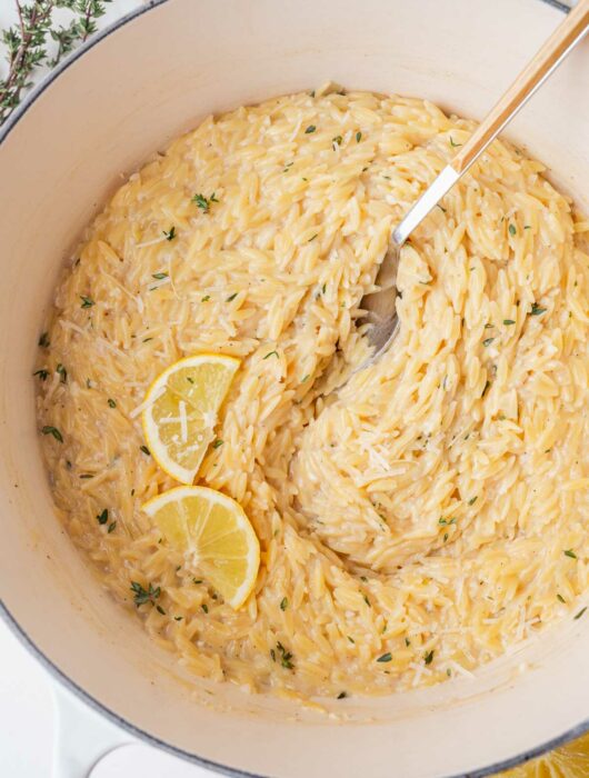 Lemon parmesan orzo in a white pot.