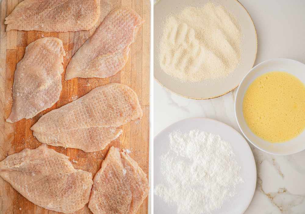 Flattened chicken fillets on a wooden board. Three plates with flour, breadcrumbs and beaten eggs.