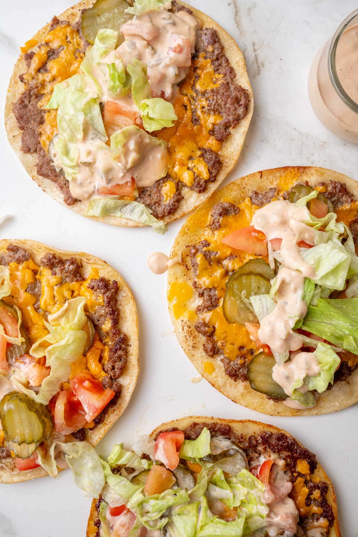 Big Mac tacos on a white counter - an overhead photo.